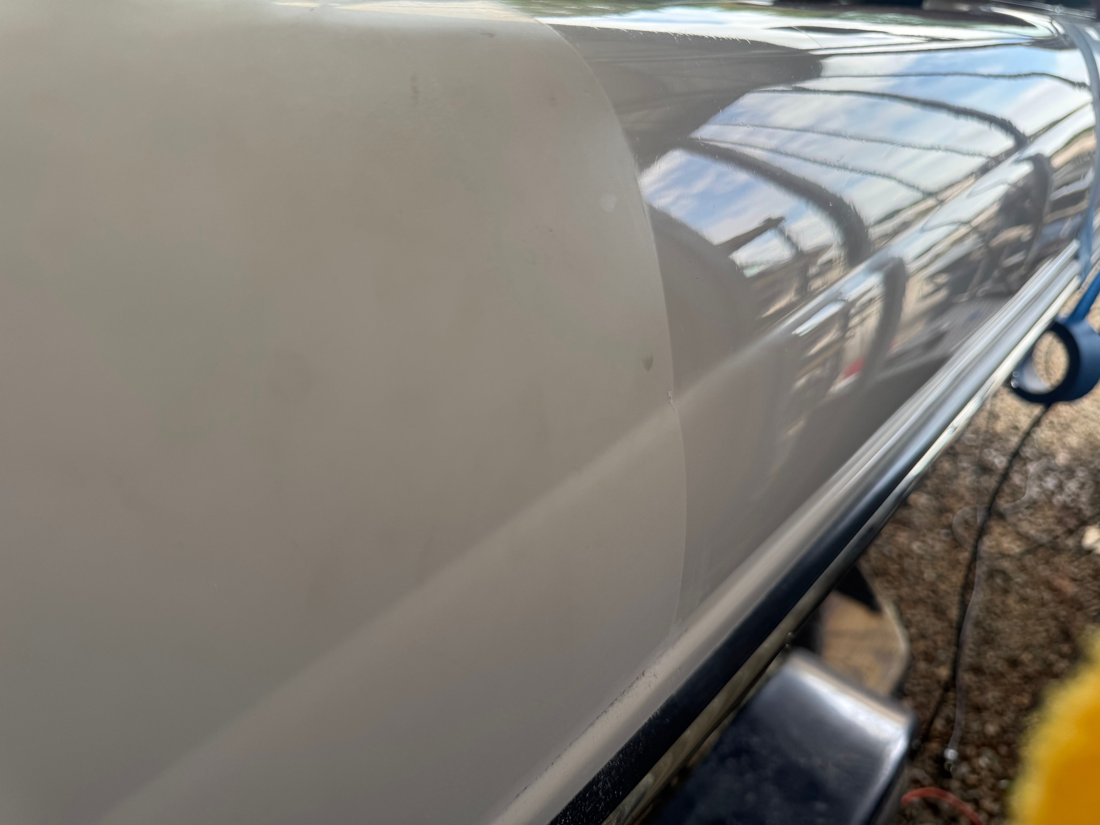 F-150 paint correction before and after — left side shows oxidized dull paint, right side shows ceramic-coated deep gloss finish